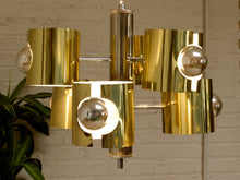 Load image into Gallery viewer, Vintage Space Age chandelier with polished brass cylindrical shades, mirrored chrome spheres, multiple lights, and chain suspension
