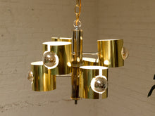 Load image into Gallery viewer, Vintage Space Age chandelier with polished brass cylindrical shades, mirrored chrome spheres, multiple lights, and chain suspension
