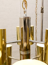 Load image into Gallery viewer, Vintage Space Age chandelier with polished brass cylindrical shades, mirrored chrome spheres, multiple lights, and chain suspension
