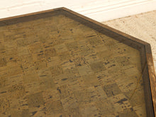 Load image into Gallery viewer, Hexagonal table featuring a patchwork cork top with a dark wood frame, shown in a close-up detail shot.
