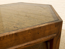Load image into Gallery viewer, Close-up of a wooden table corner with a thick medium-brown wood frame and a rectangular clear glass top showing a vintage map print underneath.
