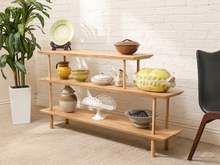 Load image into Gallery viewer, Vintage three-tier natural wood display shelf with long staggered shelves, rounded edges, slender dowel supports, and visible wood grain
