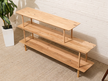 Load image into Gallery viewer, Vintage three-tier natural wood display shelf with long staggered shelves, rounded edges, slender dowel supports, and visible wood grain

