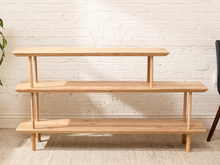 Load image into Gallery viewer, Vintage three-tier natural wood display shelf with long staggered shelves, rounded edges, slender dowel supports, and visible wood grain
