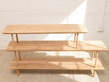 Load image into Gallery viewer, Vintage three-tier natural wood display shelf with long staggered shelves, rounded edges, slender dowel supports, and visible wood grain
