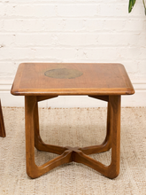 Load image into Gallery viewer, Distressed Mid-Century Lane wood side table with rounded square top, circular decorative detail, curved legs, and crossed base
