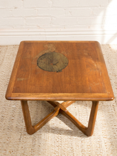 Load image into Gallery viewer, Distressed Mid-Century Lane wood side table with rounded square top, circular decorative detail, curved legs, and crossed base
