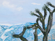 Load image into Gallery viewer, A textured painting of a Joshua tree in the foreground against a blue and white mountain landscape under a pale sky.
