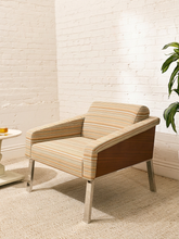 Load image into Gallery viewer, Vintage lounge chair with fine multicolor striped upholstery, loose back cushion, low upholstered arms, and warm wood platform base
