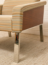 Load image into Gallery viewer, Vintage lounge chair with fine multicolor striped upholstery, loose back cushion, low upholstered arms, and warm wood platform base
