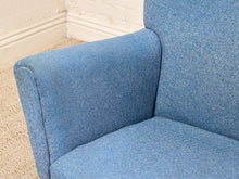 Load image into Gallery viewer, Vintage blue upholstered high-back lounge chair with angular padded arms, slender metal legs, and matching ottoman
