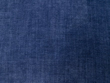 Load image into Gallery viewer, A close-up of dark blue denim fabric texture with a fine twill weave pattern.
