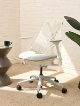 Load image into Gallery viewer, Herman Miller Sayl ergonomic office chair with flexible suspension back, dark upholstered seat, adjustable armrests, and five-star caster base
