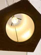 Load image into Gallery viewer, A close-up of a hanging pendant light with a dark brown hexagonal frame, a warm cream-colored inner shade, and a visible light bulb inside.
