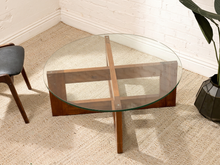 Load image into Gallery viewer, Crate &amp; Barrel chunky sculptural coffee table with round clear glass top and intersecting geometric wood base
