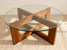 Load image into Gallery viewer, Crate &amp; Barrel chunky sculptural coffee table with round clear glass top and intersecting geometric wood base
