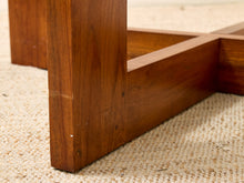 Load image into Gallery viewer, Close-up of a wooden furniture leg and corner joint on a beige woven rug.
