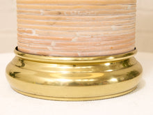 Load image into Gallery viewer, Close-up of a decorative lamp base featuring a polished gold brass circular pedestal and a stacked shell-like upper section in pale peach and cream tones.
