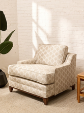 Load image into Gallery viewer, Vintage lounge chair with champagne jacquard upholstery, woven geometric wave pattern, deep seat cushion, broad back, and padded arms

