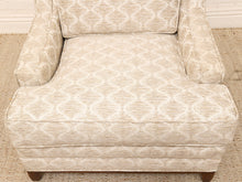 Load image into Gallery viewer, A close-up of an upholstered armchair with a textured beige and off-white geometric trellis pattern, shown from a front-facing perspective.

