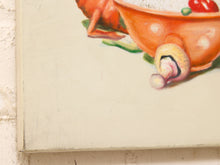 Load image into Gallery viewer, A close-up of a canvas painting showing part of a whimsical scene with an orange bowl, a mushroom, and a red tomato on a textured off-white canvas, mounted on a light wall.

