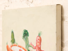 Load image into Gallery viewer, A close-up of a canvas art print showing a whimsical painting of vegetables, including a carrot character, on a textured off-white background.
