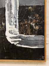 Load image into Gallery viewer, An abstract expressionist painting featuring thick, textured impasto brushstrokes in black, white, gray, and brown, housed in a light wood frame and mounted on a white brick wall.

