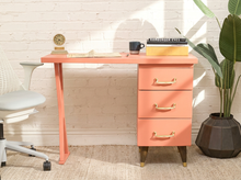 Load image into Gallery viewer, Vintage peach single pedestal desk with rectangular top, three storage drawers, metal pulls, and sculptural open-frame leg
