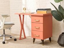 Load image into Gallery viewer, Vintage peach single pedestal desk with rectangular top, three storage drawers, metal pulls, and sculptural open-frame leg
