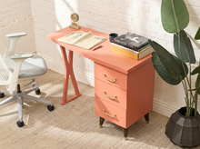 Load image into Gallery viewer, Vintage peach single pedestal desk with rectangular top, three storage drawers, metal pulls, and sculptural open-frame leg

