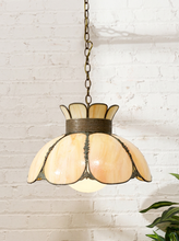 Load image into Gallery viewer, Vintage floral pendant light with large curved cream and honey slag glass petals, ornate dark metal framework, and crown-like top
