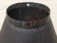 Load image into Gallery viewer, Close-up of a rustic black metal conical container or pot with a textured, speckled finish and pre-drilled holes near the rim, set against a light background.

