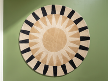 Load image into Gallery viewer, Contemporary round area rug with taupe and cream sunburst pattern, neutral circular center, and bold black and cream striped border

