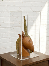 Load image into Gallery viewer, Carved wood unicorn head sculpture with ornate metallic spiral horn displayed inside a clear rectangular acrylic case
