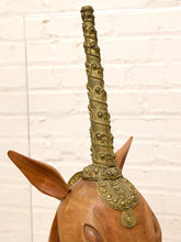 Load image into Gallery viewer, Carved wood unicorn head sculpture with ornate metallic spiral horn displayed inside a clear rectangular acrylic case
