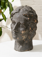 Load image into Gallery viewer, Vintage classical female head sculpture with intricately styled hair, dark textured finish, and weathered aged surface
