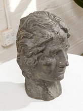 Load image into Gallery viewer, Vintage classical female head sculpture with intricately styled hair, dark textured finish, and weathered aged surface
