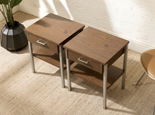Load image into Gallery viewer, Pair of vintage wood nightstands with single drawers, metal pulls, open lower shelves, and slim metal legs
