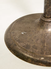 Load image into Gallery viewer, Close-up of a distressed, vintage-style metal lamp base with a dark, weathered bronze finish and a small white mark on the surface, set against a plain off-white background.
