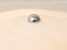 Load image into Gallery viewer, A close-up shot of a shiny chrome dome-shaped knob mounted on a cream-colored ceramic or porcelain surface.
