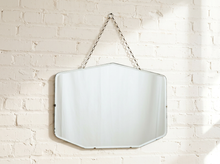 Load image into Gallery viewer, Vintage frameless Art Deco mirror with beveled edges, clipped geometric corners, and visible aged patina
