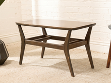 Load image into Gallery viewer, Vintage rectangular table with woodgrain Formica top, rounded corners, dark wood base, angled legs, and horizontal supports
