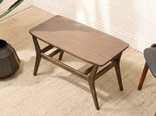 Load image into Gallery viewer, Vintage rectangular table with woodgrain Formica top, rounded corners, dark wood base, angled legs, and horizontal supports
