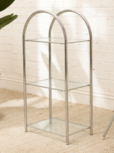 Load image into Gallery viewer, Vintage three-tier display shelf with polished chrome tubular frame, clear glass shelves, and tall rounded supports

