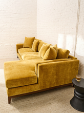 Load image into Gallery viewer, Lisette Sofa with Chaise in Sacramento Honey featuring golden mustard upholstery, plush seat cushions, coordinating pillows, wide arms, and wood legs

