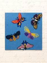 Load image into Gallery viewer, Butterfly textile wall art with five colorful embroidered butterflies and moths in bright yarn on a dusty blue background
