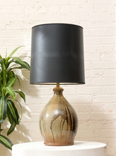 Load image into Gallery viewer, Vintage table lamp with rounded earthy brown and gray drip-glaze base and large black drum shade
