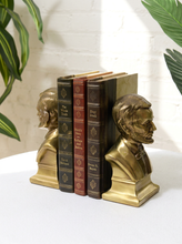 Load image into Gallery viewer, Pair of vintage brass Abraham Lincoln bust bookends with detailed profiles, period clothing, warm patina, and stepped bases
