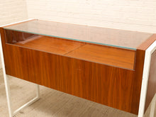 Load image into Gallery viewer, Danish modern wood jewelry display case with clear glass top, multiple shallow drawers, and squared metal frame and legs

