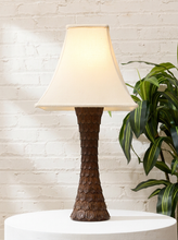 Load image into Gallery viewer, Vintage table lamp with tall tapered dark brown textured base and classic off-white bell-shaped fabric shade
